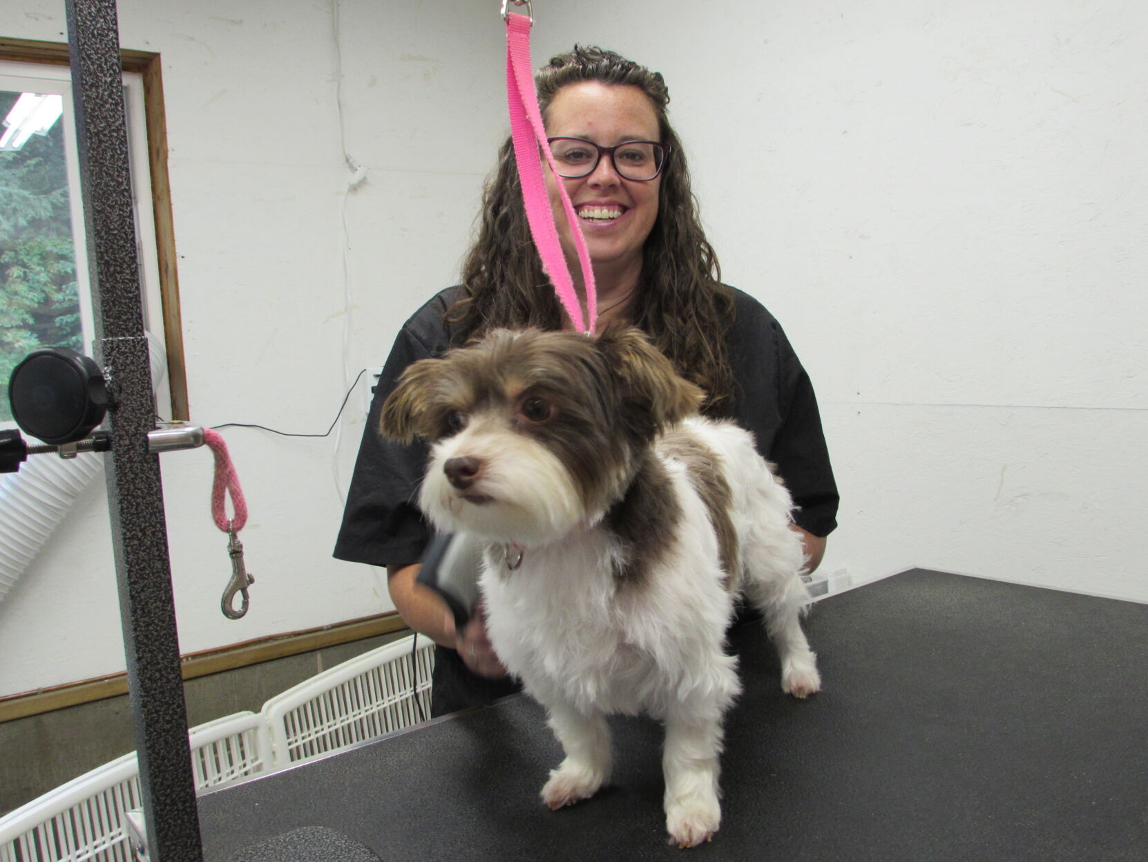 Nicole Mathews of Nicole’s D.O.G. Salon in Candor with her client, Ladybug.